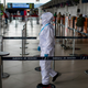 An employee walks at El Alto International Airport in El Alto, Bolivia, on Oct. 21, 2020.